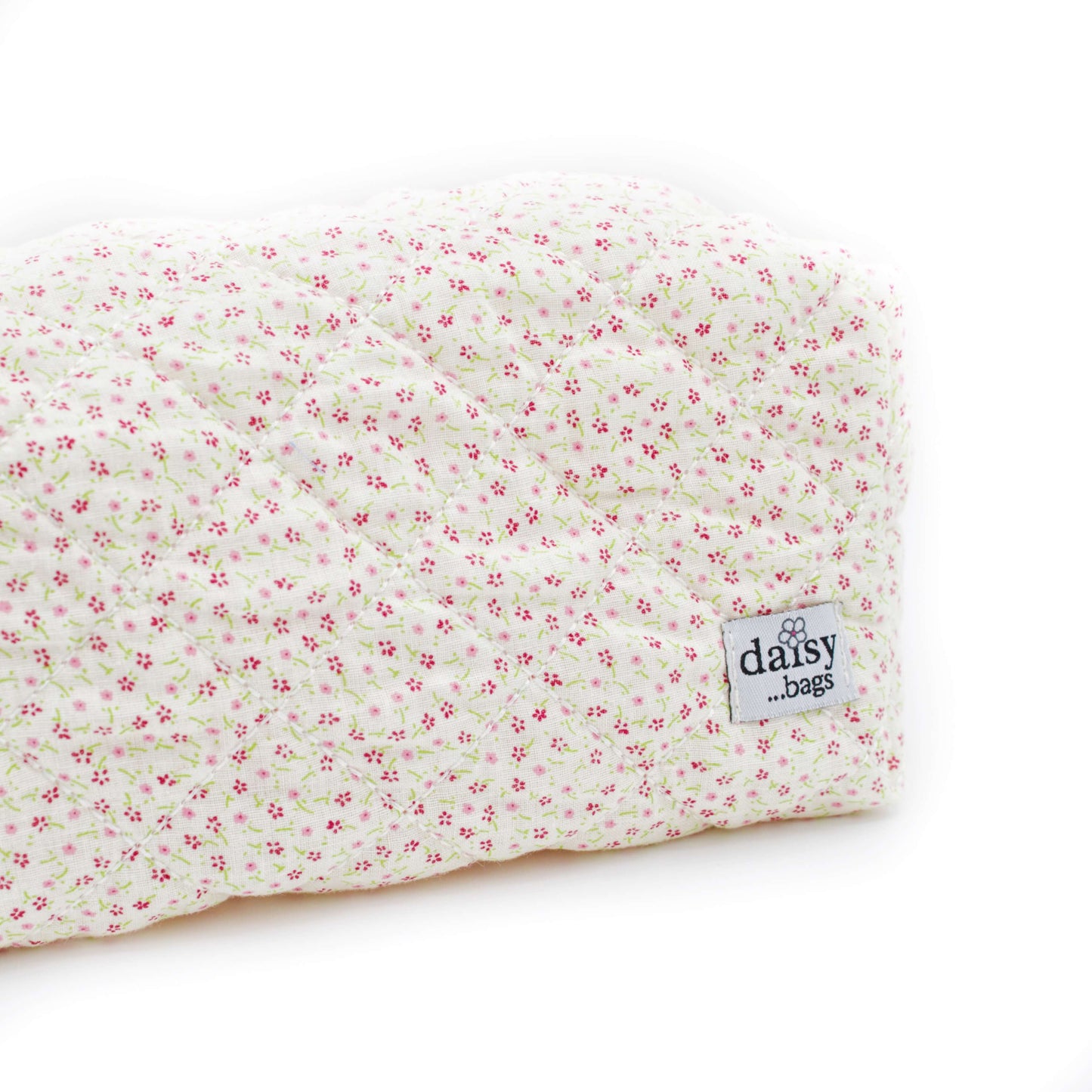 The Bloom floral makeup bag against a white background