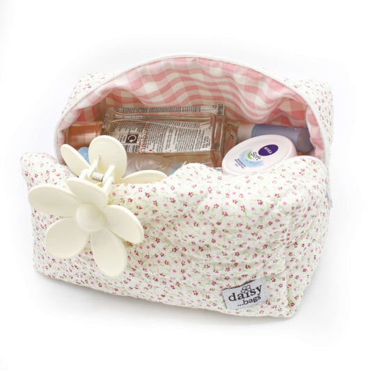 The Bloom floral makeup bag on a white background