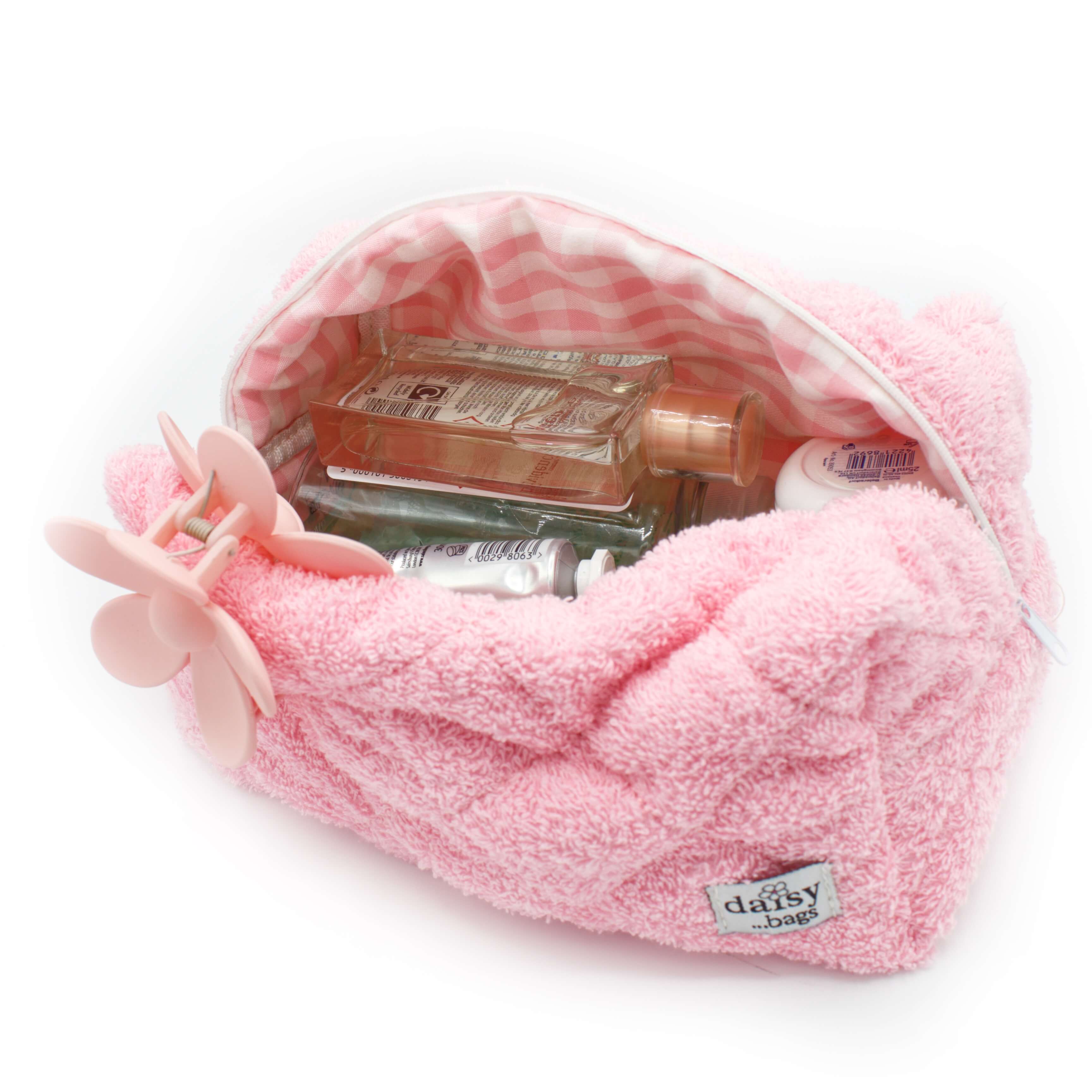 The Leela pink makeup bag on a white background